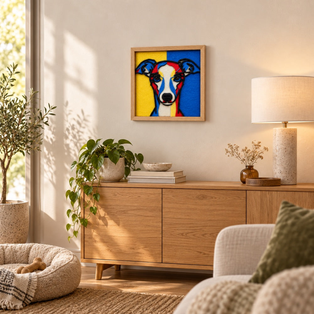 A 30 cm carnival color felt dog portrait hanging on a living room wall above an oak sideboard with plants and a lamp